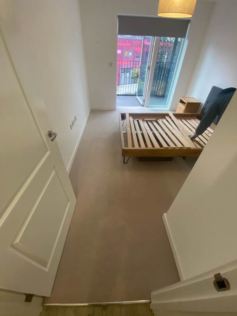 Brockway Carpets Dimensions Plain Pale Stone installation in-Main