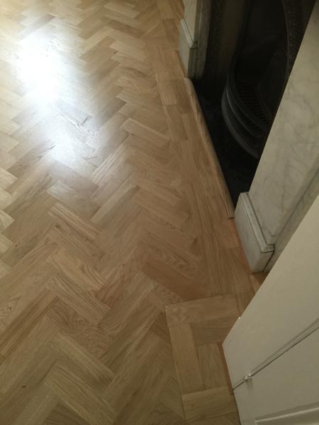 portfolio hardwood flooring living room herringone 03