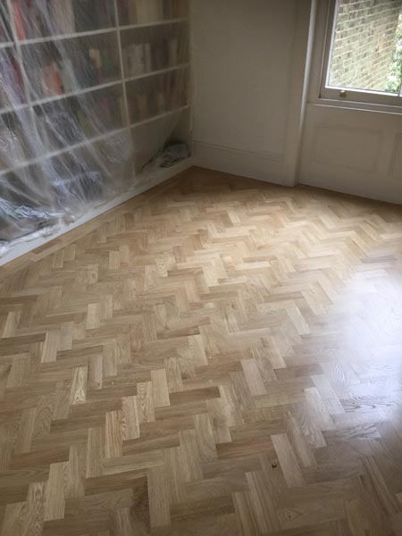 portfolio hardwood flooring living room herringone 04