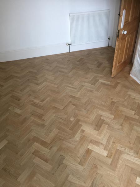 portfolio hardwood flooring living room herringone 05