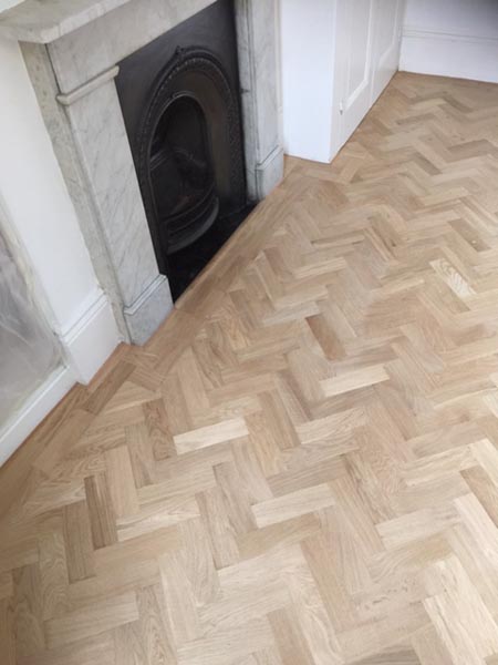 portfolio hardwood flooring living room herringone 08