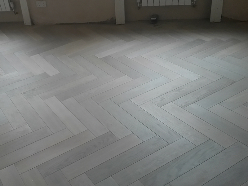portfolio hardwood floors - herringbone wood install